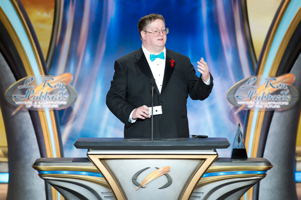 Martin L. Shoemaker on stage accepting his award