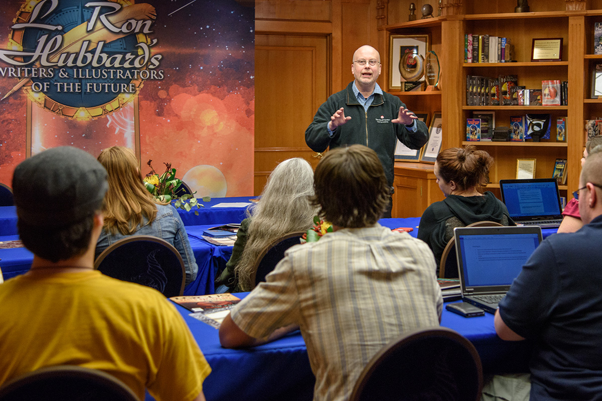 Robert J. Sawyer giving a helping hand at the workshop to winners of the Writers of the Future Contest.