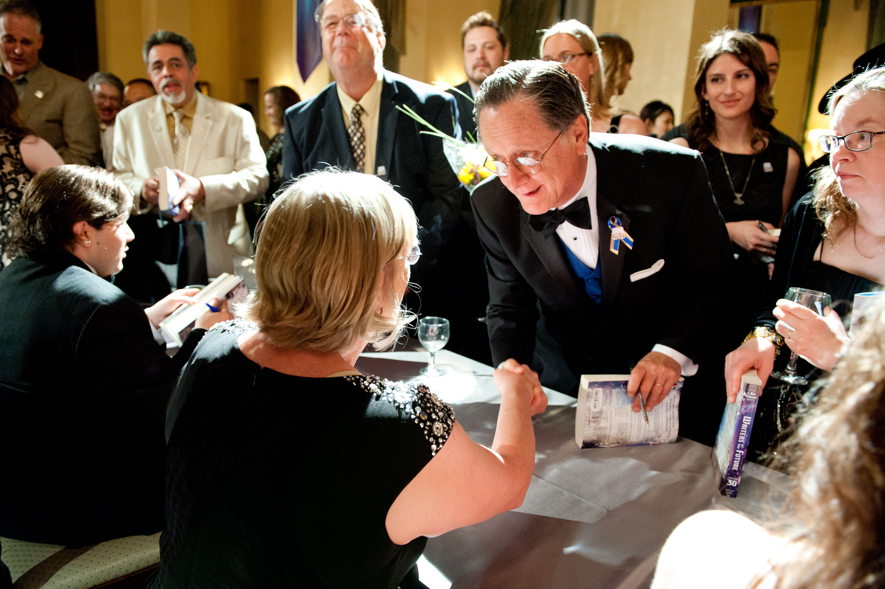 Award-winning author Tim Powers getting his book signed by winners.