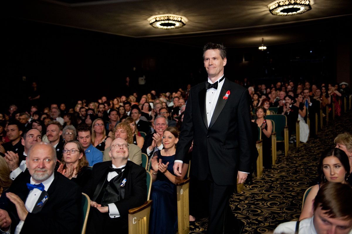 C Stuart Hardwick walking to stage